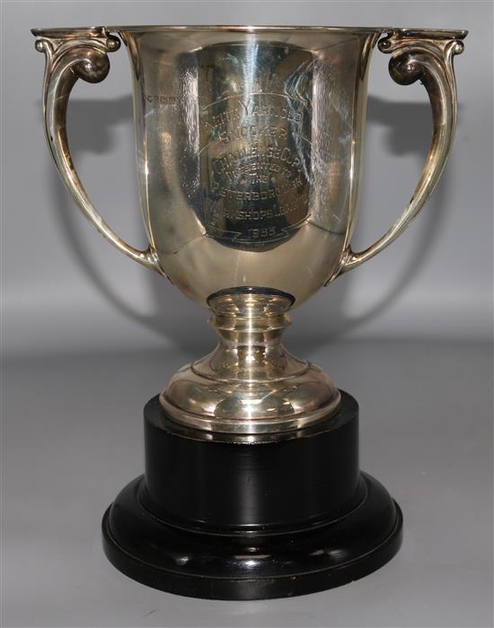 A George V silver two handled presentation cup with engraved snooker related inscription, on ebonised socle.